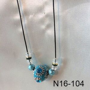 Black cord necklace with turquoise colored beads and clear crystal beads